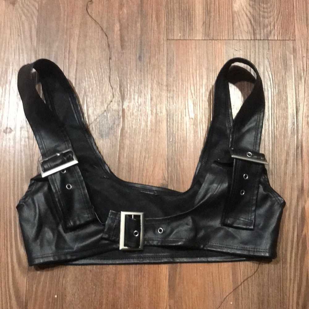 Small faux leather top. Doesn't fit me right because I'm extremely small haha.